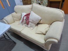A Cream Upholstered, wide two Seater Sofa