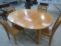 A Solid Wooden Table and Four Chairs