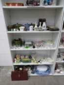 Four shelves to include a selection of Ceramics, Glassware