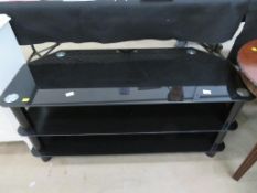 A Three Tier Black Glass TV Stand