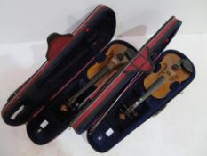 Two cased 1/4 size The Stentor Student II Violins
