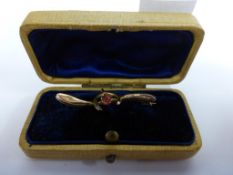 A 9ct Gold Brooch with Red Gemstone