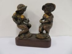 Two mounted Bronze (?) Figures on a plinth