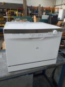 An Indesit AAA Counter Top Dishwasher