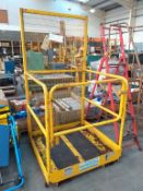 A Contract Forklift Lifting Personel Cage