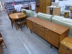 A McIntosh Teak Extending Dining Table and Six Chairs with a Teak Sideboard