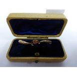 This is a Timed Online Auction on Bidspotter.co.uk, Click here to bid. A 9ct Gold Brooch with Red