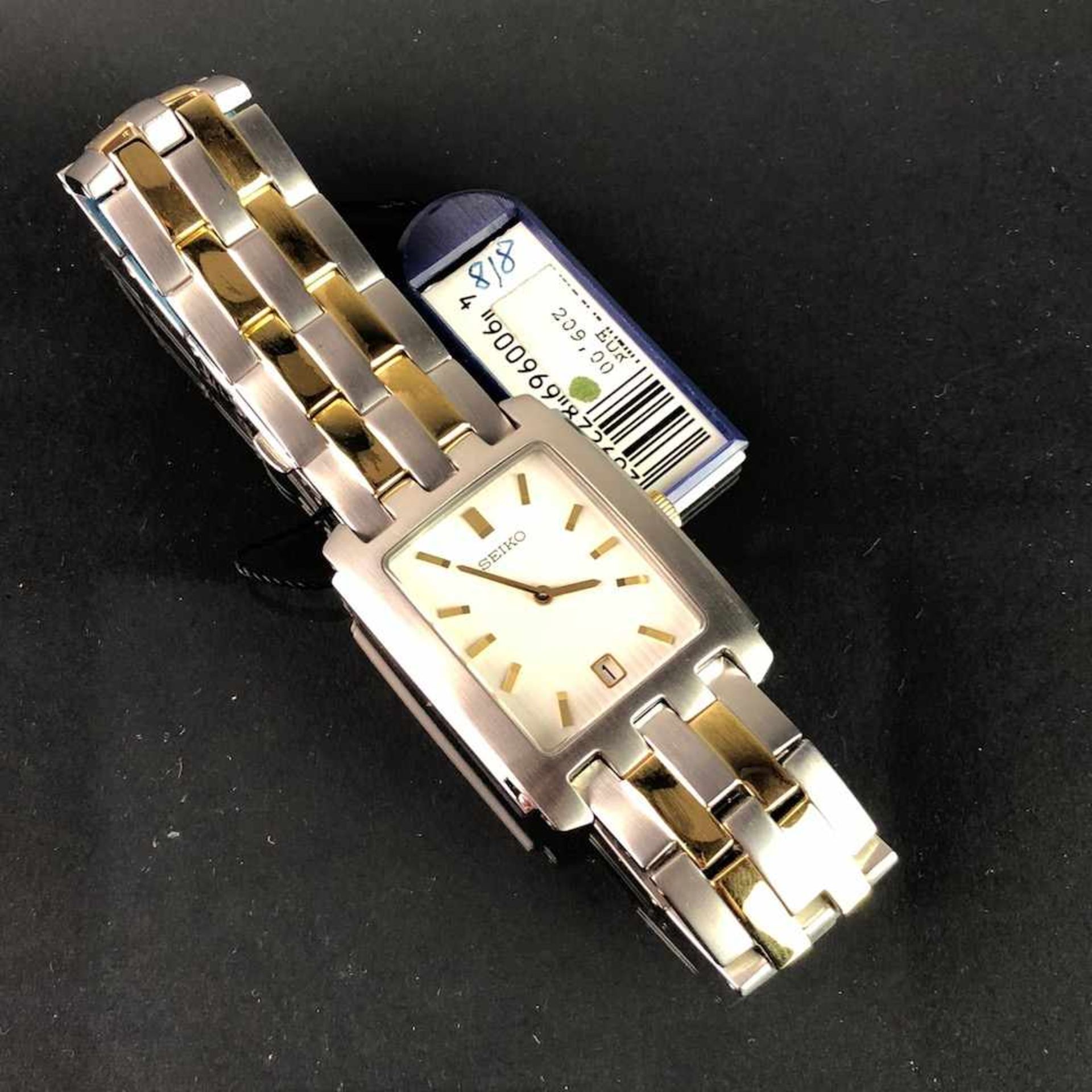 Armbanduhr: "SEIKO". Edelstahl matiert und bicolor. Mineralglas. Ungetragen aus Uhrmachernachlaß.