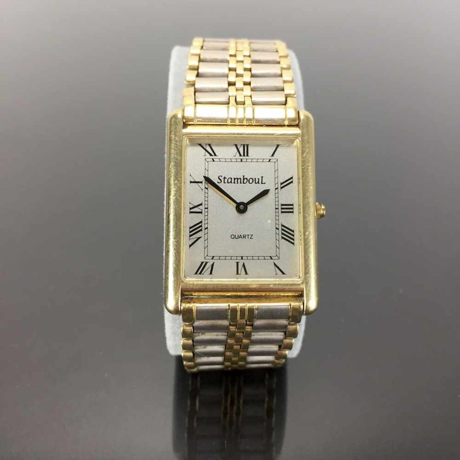 Schwere Herren Armbanduhr: Gold 585 / 14 K.Gemarkt "StambouL | Quartz". Rechteckiges Gehäuse aus