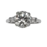 A 3.19 CARAT SOLITAIRE DIAMOND RING in white gold or platinum, set with a central round cut