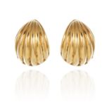 A PAIR OF SHELL EARRINGS in 18ct yellow gold, each tapering body with fluted shell decoration,