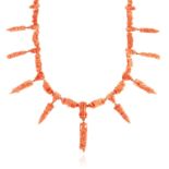 AN ANTIQUE CARVED CORAL NECKLACE, ITALIAN 19TH CENTURY in high carat yellow gold, formed of carved