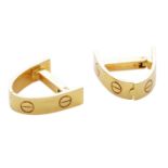 A PAIR OF LOVE CUFFLINKS BY CARTIER in 18ct yellow gold, with screw head designs, signed Cartier and