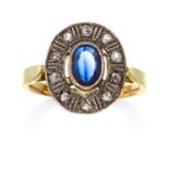 A SAPPHIRE AND DIAMOND RING in high carat yellow gold and silver, the oval cut sapphire of 0.80