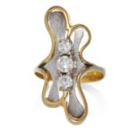 A VINTAGE DIAMOND RING in high carat yellow and white gold, the abstract design set with a trio of