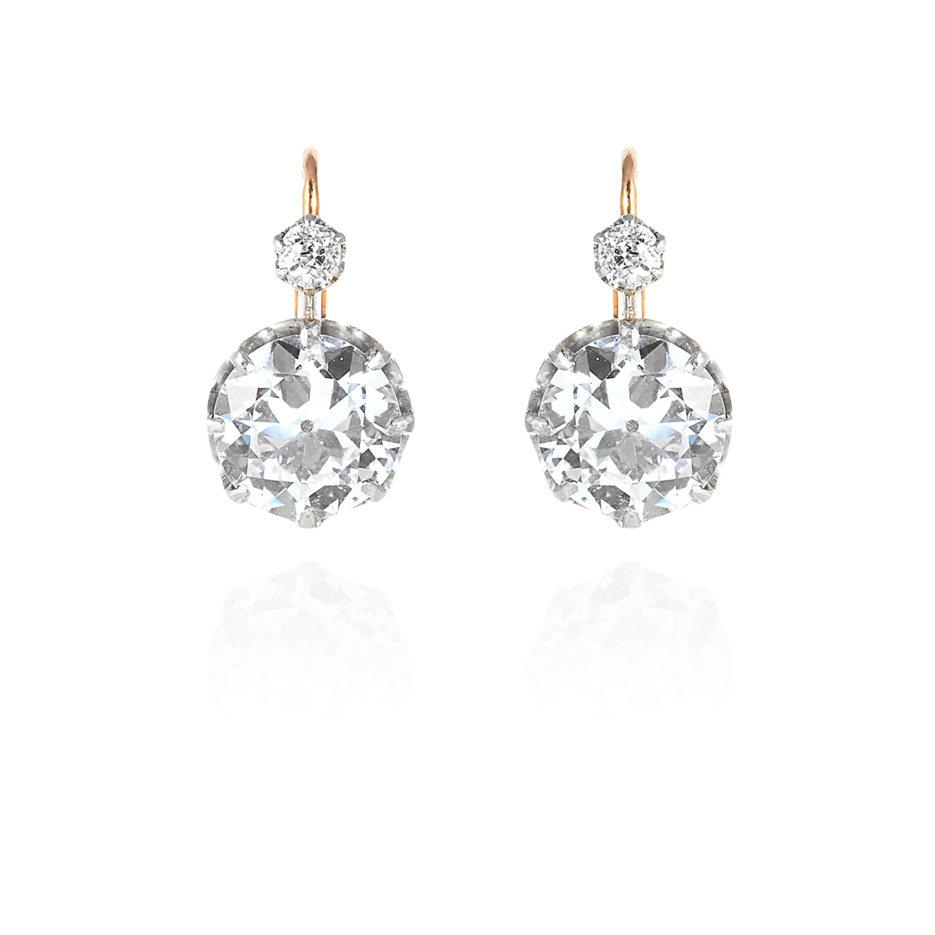 A PAIR OF ANTIQUE DIAMOND EARRINGS in 18ct yellow gold and silver, each set with an old round cut