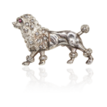 A RUBY AND DIAMOND POODLE BROOCH designed as a poodle, walking, cast in detail, its body jewelled