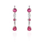 A PAIR OF RUBY AND DIAMOND EARRINGS in white gold or platinum, drops of alternating rubies and