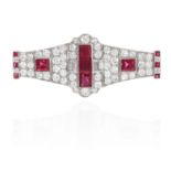 AN ART DECO BURMA NO HEAT RUBY AND DIAMOND BROOCH in platinum or white gold, set with a central trio