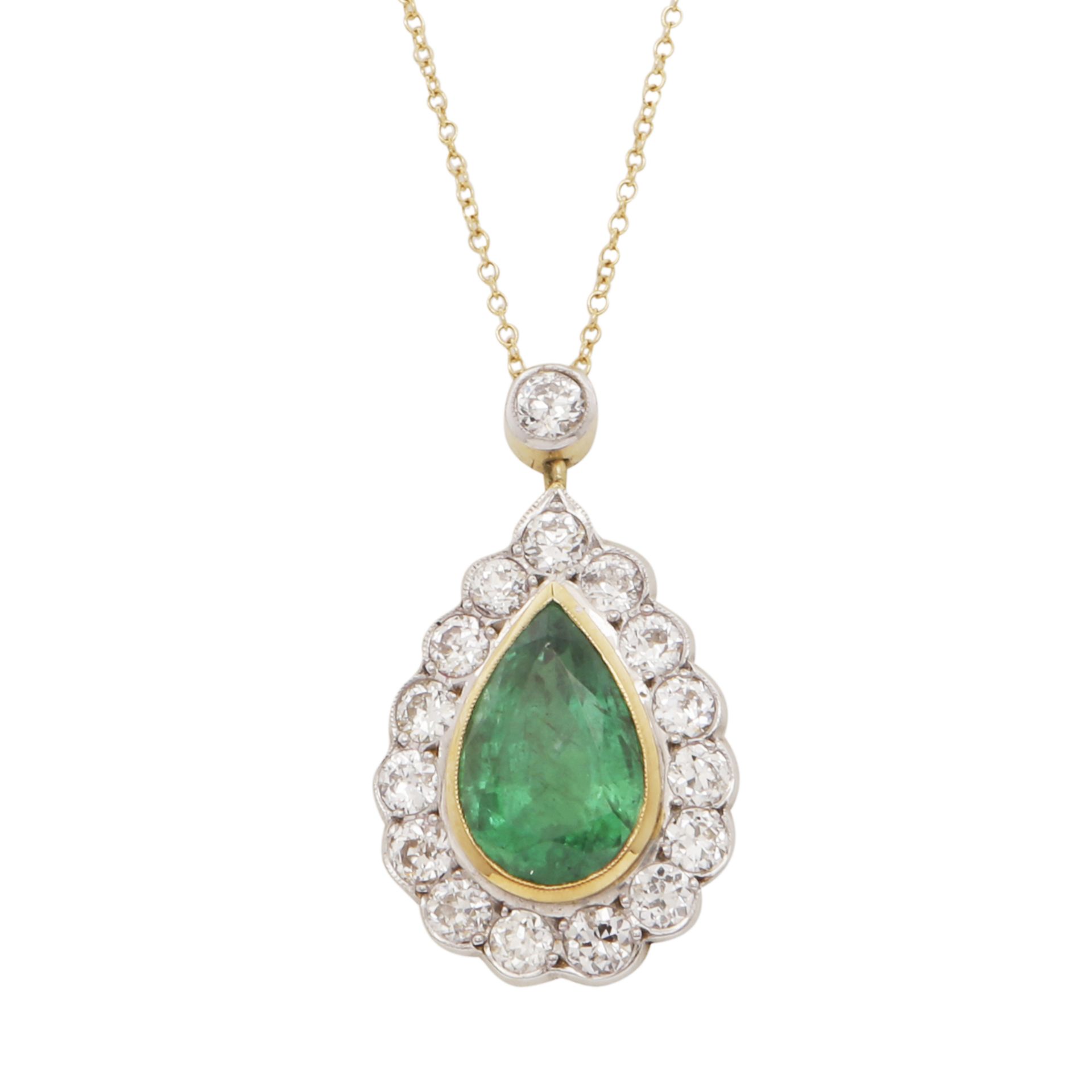 AN EMERALD AND DIAMOND PENDANT in 18ct yellow and white gold, the 4.76 carat pear cut emerald