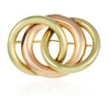 A VINTAGE BROOCH, TIFFANY & CO in 14ct yellow and rose gold, formed of three interlocking rings,