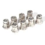 A SET OF EIGHT SALT & PEPPER POTS, CARTIER in sterling silver, each of tapering octagonal form,