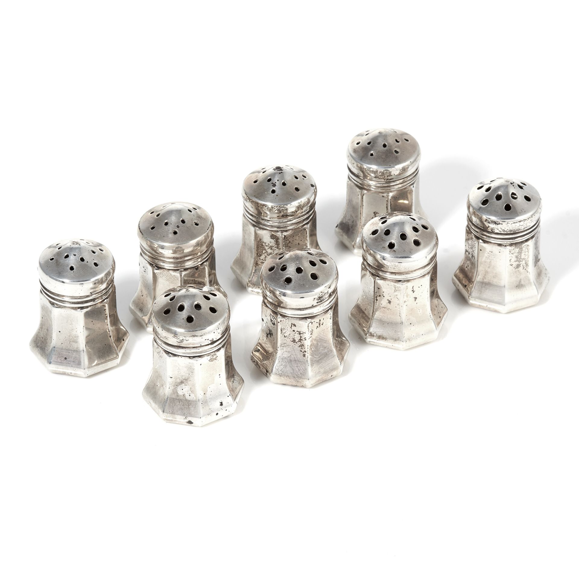 A SET OF EIGHT SALT & PEPPER POTS, CARTIER in sterling silver, each of tapering octagonal form,