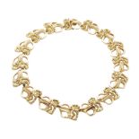 A VINTAGE FANCY LINK GOLD COLLAR NECKLACE, CHAUMET CIRCA 1980 comprising a single row of fancy