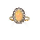AN OPAL AND DIAMOND CLUSTER RING in 18ct yellow gold, the oval opal cabochon encircled by round