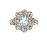 AN ANTIQUE AQUAMARINE AND DIAMOND RING in yellow gold and silver, oval cut aquamarine of 1.10 carats