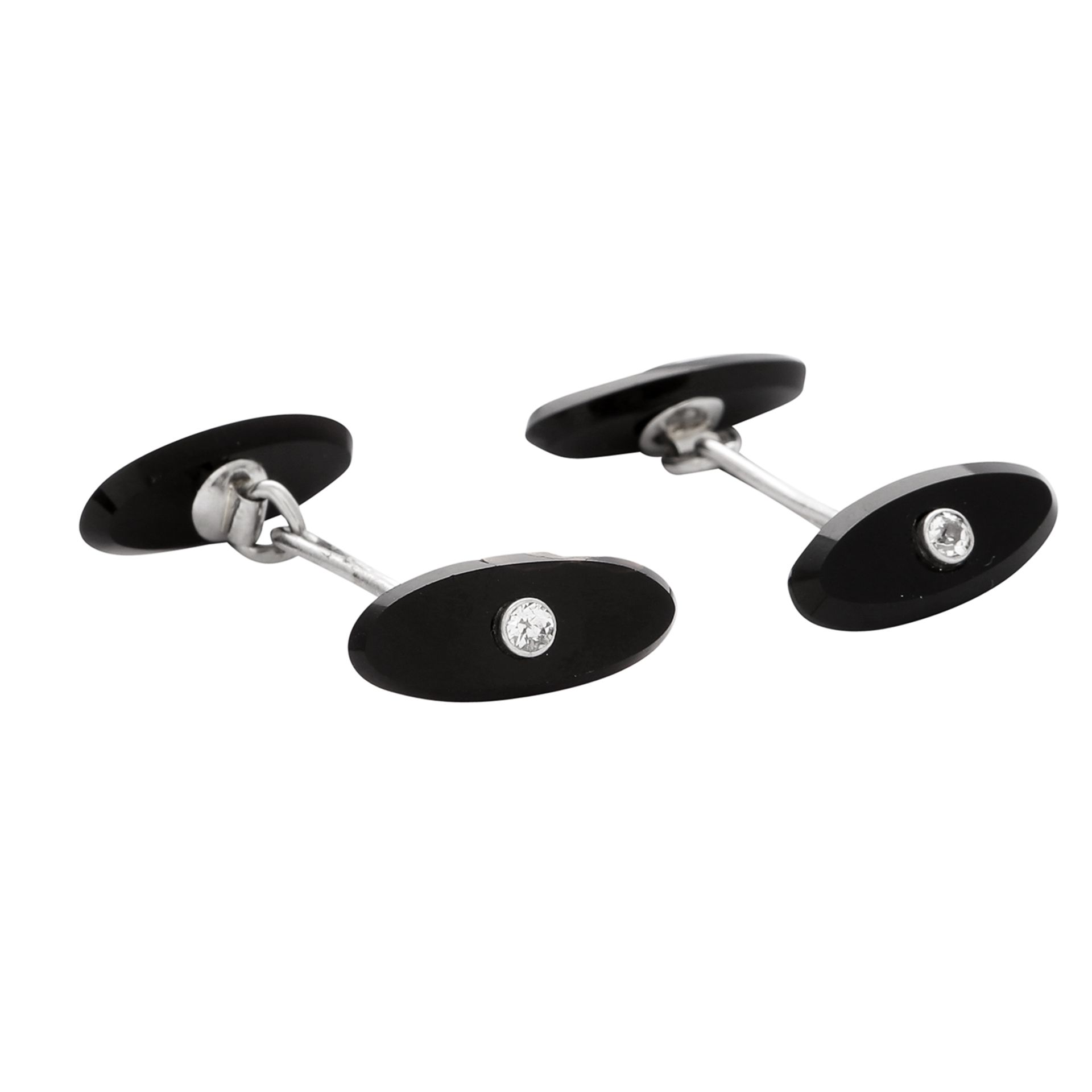A PAIR OF ART DECO DIAMOND AND ONYX CUFFLINKS in platinum, each formed of two elongated oval