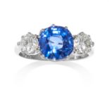 AN UNHEATED SAPPHIRE AND DIAMOND RING in platinum, set with a central cushion cut sapphire of 3.70