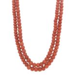 AN ANTIQUE CORAL BEAD NECKLACE in high carat yellow gold, comprising two rows of one hundred and