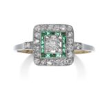 AN ART DECO DIAMOND AND EMERALD RING in high carat yellow gold and platinum, the old cut diamond