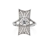 AN ART DECO DIAMOND RING in platinum, the rectangular face set with a central diamond of 0.40