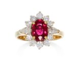 A 1.0 CARAT RUBY AND DIAMOND CLUSTER RING in 18ct yellow gold, the oval cut ruby of 1.0 carats