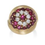 A VINTAGE RUBY AND DIAMOND RING in high carat yellow gold, the cluster of round cut rubies and