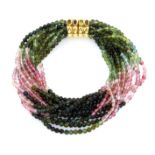 A PINK AND GREEN TOURMALINE AND SAPPHIRE TORSADE BRACELET in 18ct yellow gold, for multi strand