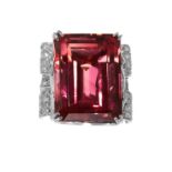 A RUBELLITE TOURMALINE AND DIAMOND COCKTAIL RING in platinum, set with a step cut rubellite of 39.73
