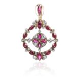 A RUBY AND DIAMOND PENDANT in high carat yellow gold jewelled with circular motifs of fancy shaped