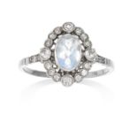 AN ANTIQUE MOONSTONE AND DIAMOND RING, EARLY 20TH CENTURY in platinum the oval faceted moonstone