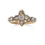 AN ANTIQUE DIAMOND RING in high carat yellow gold and silver, the central quatrefoil rose cut