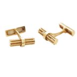 A PAIR OF VINTAGE CUFFLINKS in 18ct yellow gold, each formed of two ropetwist batons, signed