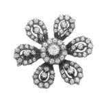 AN ANTIQUE DIAMOND FLOWER PENDANT / BROOCH, 19TH CENTURY in high carat yellow gold and silver, the