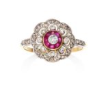 AN ANTIQUE DIAMOND AND RUBY RING in 18ct yellow gold and platinum, the round cut diamond encircled