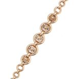 A VINTAGE DIAMOND FANCY LINK NECKLACE / BRACELET SUITE in 18ct yellow gold, formed of graduated