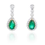 A PAIR OF EMERALD AND DIAMOND EARRINGS in 18ct white gold, each set with a pear cut emerald