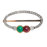 AN ANTIQUE EMERALD, RUBY AND DIAMOND BROOCH in yellow gold and platinum of oval form, set with round