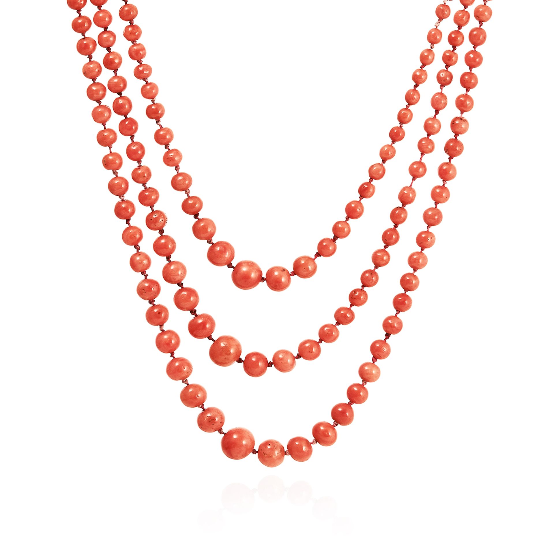 AN ANTIQUE THREE ROW CORAL BEAD NECKLACE in yellow gold comprising three rows of two hundred and