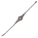 A DIAMOND BRACELET, EARLY 19TH CENTURY, in white gold or silver, comprising of central floral